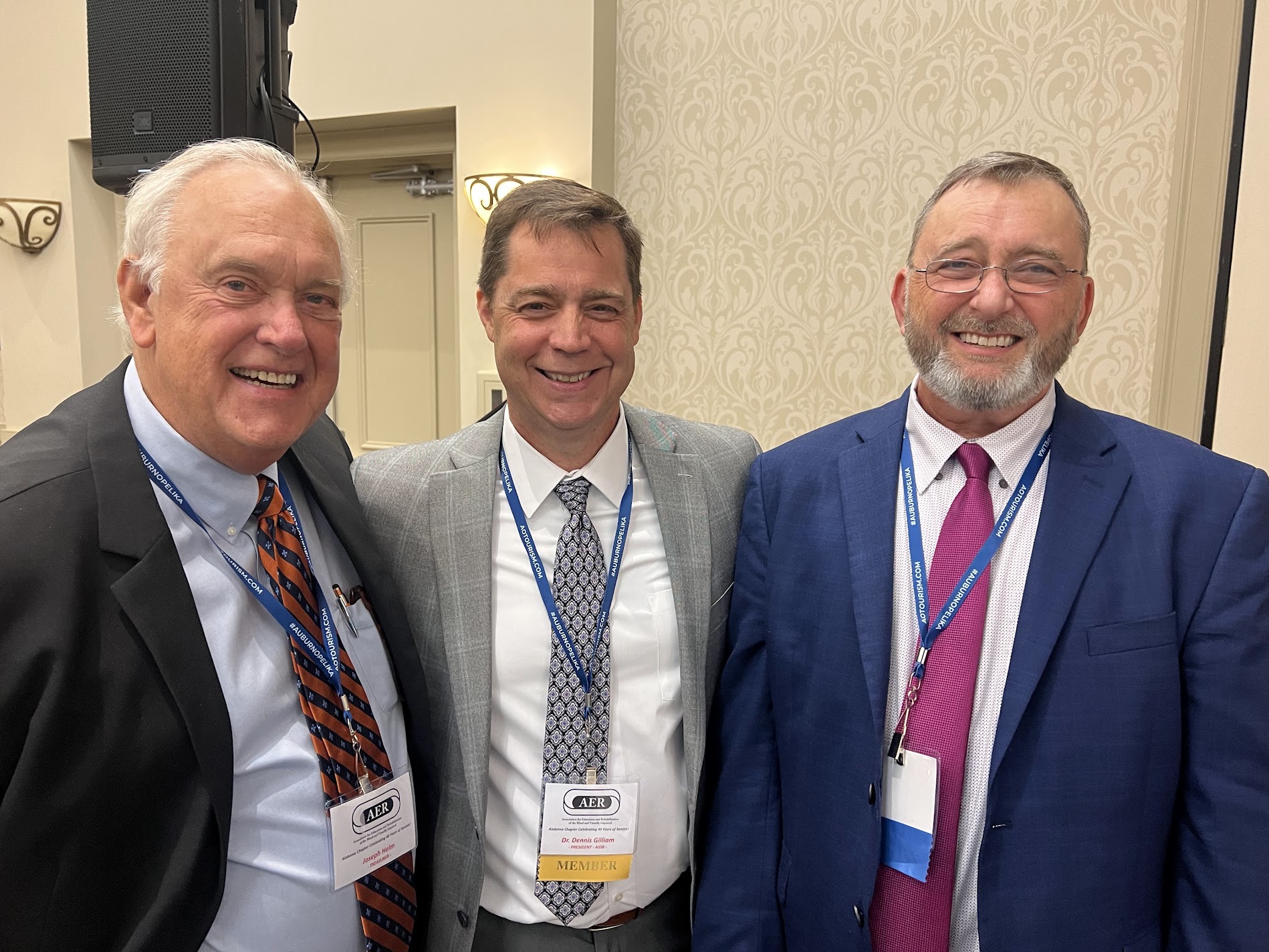 Joe Helm, Steve Sullivan share humor with Dr. Dennis Gilliam newly appointed President of AIDB.
