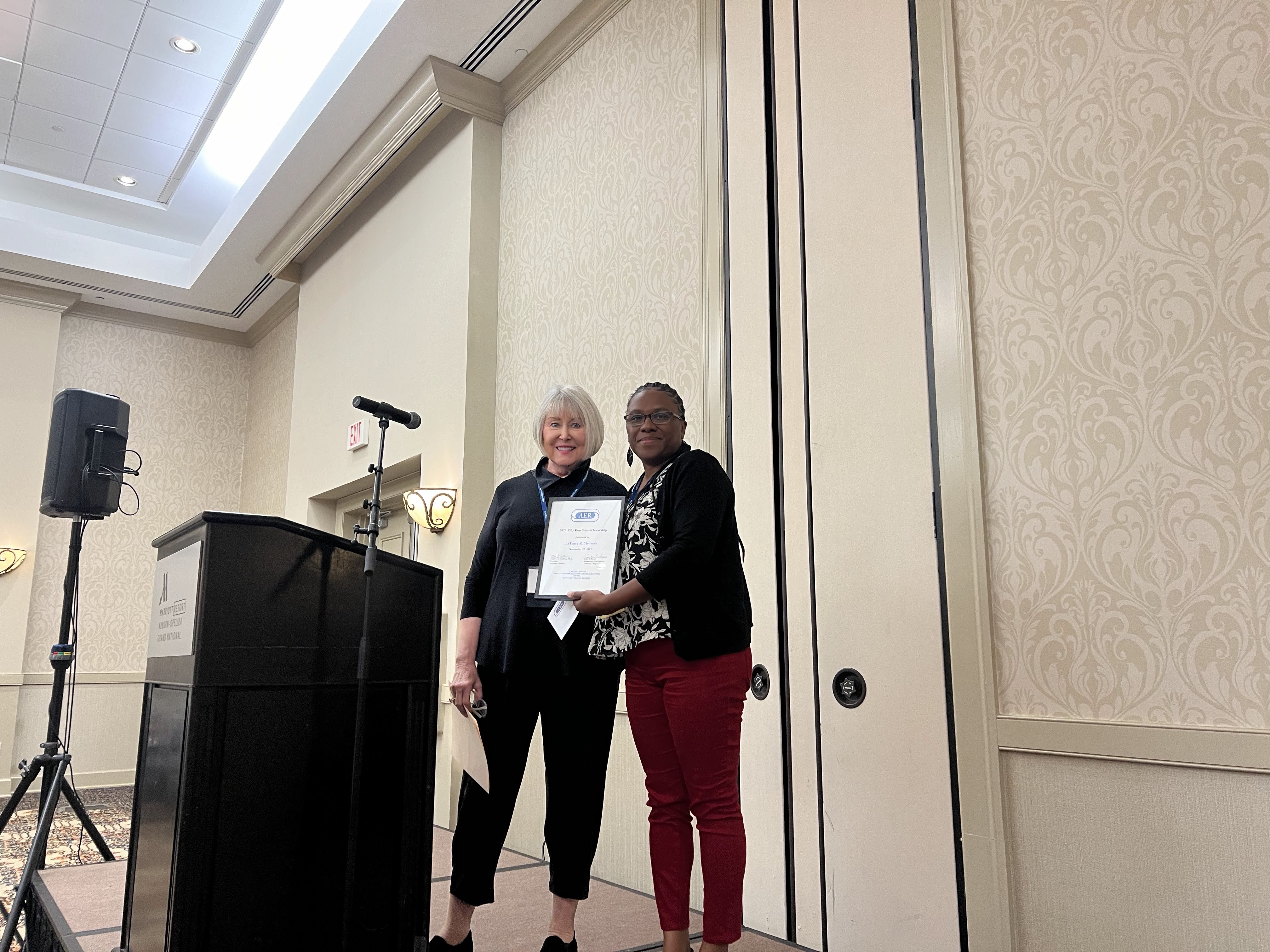 Julie Brock Scholarship Chair presents the Billy Don Sims Scholarship to LaTonya R. Chatman